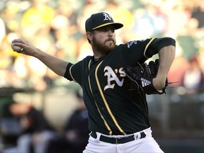 Oakland Athletics pitcher Paul Blackburn throws against the San Francisco Giants during the first inning of a baseball game in Oakland, Calif., Monday, July 31, 2017. (AP Photo/Jeff Chiu)