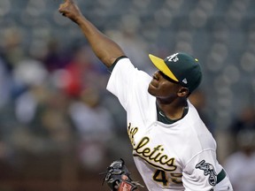 Oakland Athletics pitcher Jharel Cotton works against the Kansas City Royals in the first inning of a baseball game, Monday, Aug. 14, 2017, in Oakland, Calif. (AP Photo/Ben Margot)