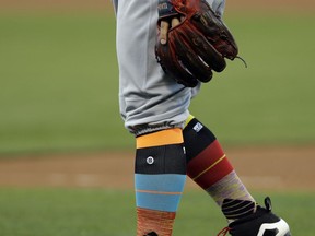 Socks worn by Texas Rangers' Rougned Odor are seen in the first inning of the team's baseball game against the Oakland Athletics on Friday, Aug. 25, 2017, in Oakland, Calif. (AP Photo/Ben Margot)