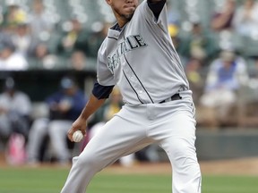 Seattle Mariners starting pitcher Yovani Gallardo throws to the Oakland Athletics during the first inning of a baseball game Wednesday, Aug. 9, 2017, in Oakland, Calif. (AP Photo/Marcio Jose Sanchez)