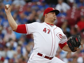 Cincinnati Reds starting pitcher Sal Romano throws during the first inning of a baseball game against the Chicago Cubs, Thursday, Aug. 24, 2017, in Cincinnati. (AP Photo/John Minchillo)