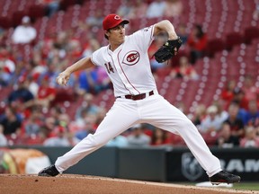 Cincinnati Reds starting pitcher Homer Bailey throws during the first inning of a baseball game against the New York Mets, Wednesday, Aug. 30, 2017, in Cincinnati. (AP Photo/John Minchillo)