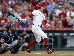 Cincinnati Reds' Joey Votto watches his double off San Diego Padres' Travis Wood during the first inning of a baseball game, Wednesday, Aug. 9, 2017, in Cincinnati. (AP Photo/John Minchillo)
