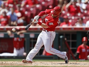 Cincinnati Reds' Tucker Barnhart hits a two-run double off San Diego Padres starting pitcher Dinelson Lamet in the second inning of a baseball game, Thursday, Aug. 10, 2017, in Cincinnati. (AP Photo/John Minchillo)