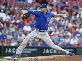 Chicago Cubs pitcher Mike Montgomery winds up during the first inning of a baseball game against the Cincinnati Reds, Wednesday, Aug. 23, 2017, in Cincinnati. (AP Photo/John Minchillo)