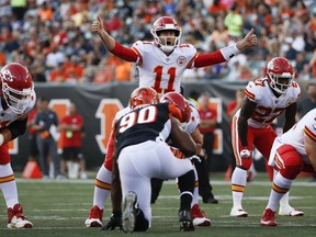 Kansas City Chiefs quarterback Alex Smith (11) directs his players during the first half of an NFL preseason football game against the Cincinnati Bengals, Saturday, Aug. 19, 2017, in Cincinnati. (AP Photo/Frank Victores)