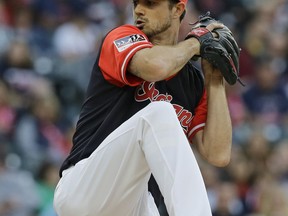 Cleveland Indians starting pitcher Ryan Merritt winds up during the first inning of the team's baseball game against the Kansas City Royals, Friday, Aug. 25, 2017, in Cleveland. (AP Photo/Tony Dejak)