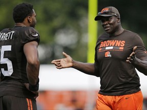 NFL Hall of Famer Bruce Smith, right, talks with Myles Garrett during practice at the NFL football team's training camp facility, Wednesday, Aug. 2, 2017, in Berea, Ohio. (AP Photo/Tony Dejak)