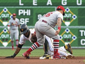 Pittsburgh Pirates' Starling Marte (6) steals second base as St. Louis Cardinals' Kolten Wong (16) makes a late tag in the fourth inning of a baseball game in Pittsburgh, Saturday, Aug. 19, 2017. (AP Photo/Fred Vuich)