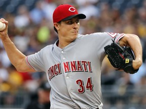 Cincinnati Reds starting pitcher Homer Bailey delivers during the first inning of the team's baseball game against the Pittsburgh Pirates in Pittsburgh, Tuesday, Aug. 1, 2017. (AP Photo/Gene J. Puskar)
