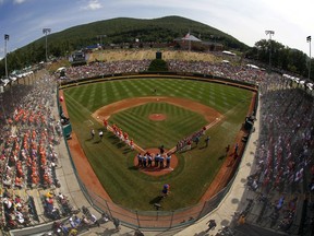 Japan and Texas line the baselines at Lamade Stadium during introductions before the Little League World Series Championship baseball game in South Williamsport, Pa., Sunday, Aug. 27, 2017. (AP Photo/Gene J. Puskar).