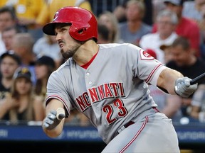 Cincinnati Reds' Adam Duvall watches his RBI sacrifice fly against the Pittsburgh Pirates during the fourth inning of a baseball game in Pittsburgh, Wednesday, Aug. 2, 2017. (AP Photo/Gene J. Puskar)