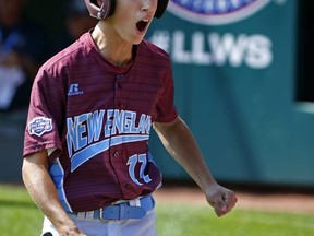 Fairfield, Conn.'s Matthew Vivona celebrates as he returns to his dugout after scoring in the first inning on a single by Chris Cartnick during a baseball game against Jackson, N.J., in United States pool play at the Little League World Series tournament in South Williamsport, Pa., Thursday, Aug. 17, 2017. (AP Photo/Gene J. Puskar)