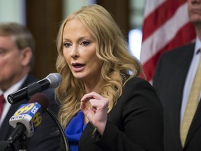 FILE – In this May 5, 2017, file photo, Centre County District Attorney Stacy Parks Miller announces findings of an investigation into the death of a Penn State University fraternity pledge, during a news conference in Bellefonte, Pa. The Disciplinary Board of the Supreme Court of Pennsylvania, a state board that handles complaints about lawyers, on Wednesday, Aug. 16, 2017, scheduled a Nov. 29, 2017, hearing to consider whether Parks Miller committed professional misconduct by contacting judges about cases without informing defense lawyers, and by using a fake Facebook account to monitor defendants and their families. (Joe Hermitt/PennLive.com via AP, File)