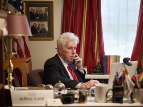 FILE- In this Sept. 16, 2016, file photo, Jeffrey Lord prepares for a CNN broadcast from his home office in Camp Hill, Pa. CNN cut ties Thursday, Aug. 10, 2017, with Lord, a conservative commentator, after he tweeted a Nazi salute at a critic. (Daniel Zampogna/PennLive.com via AP, File)
