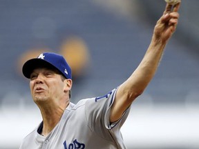 Los Angeles Dodgers starter Rich Hill pitches against the Pittsburgh Pirates in the first inning of a baseball game, Wednesday, Aug. 23, 2017, in Pittsburgh. (AP Photo/Keith Srakocic)