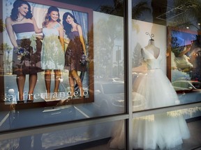 A window display is seen at Alfredo Angelo bridal store in West Covina, Calif., Friday, July 14, 2017. Florida-based bridal retailer Alfred Angelo shuttered its 60 U.S. stores and filed for Chapter 7 bankruptcy liquidation in July, leaving brides-to-be around the world without the gowns they had already ordered.