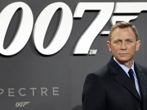 FILE - In this Oct. 28, 2015, file photo, actor Daniel Craig poses for the media as he arrives for the German premiere of the James Bond movie 'Spectre' in Berlin, Germany. Craig announced on "The Late Show with Stephen Colbert" Aug. 15, 2017, that he would return as the British super spy in 2019's "Bond 25." (AP Photo/Michael Sohn, File)