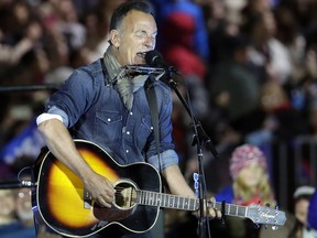 FILE - In this Nov. 7, 2016, file photo Bruce Springsteen performs during a Hillary Clinton campaign event at Independence Mall in Philadelphia. Springsteen plans to make his Broadway debut onstage this fall at the Walter Kerr Theatre in a solo show in which he performs songs from his career, interspersed with readings of his best-selling memoir "Born to Run." "Springsteen on Broadway" begins previews Oct. 3, 2017, ahead of an Oct. 12 opening. (AP Photo/Matt Slocum, File)