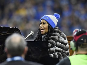 FILE - In this Nov. 24, 2016, file photo, Aretha Franklin performs the national anthem before an NFL football game between the Detroit Lions and the Minnesota Vikings in Detroit. Franklin told the Detroit Free Press for an article published Aug. 16, 2017, that she plans to move back to her hometown of Detroit. (AP Photo/Jose Juarez, File)