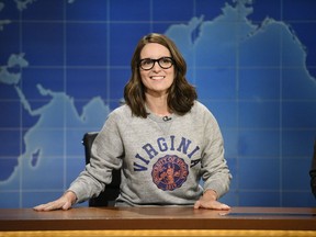 This Aug. 17, 2017, photo provided by NBC shows Tina Fey on set during the an episode of "Weekend Update: Summer Edition," in New York. Fey, a graduate of the University of Virginia, discussed last weekend's white nationalist rally near the school's Charlottesville, Va. campus, saying it broke her heart "to see these evil forces descend upon Charlottesville." (Will Heath/NBC via AP)