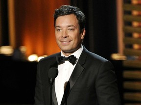 FILE - In this Aug. 25, 2014, file photo, Jimmy Fallon presents an award at the 66th Annual Primetime Emmy Awards in Los Angeles. Instead of a traditional joke-filled monologue, Jimmy Fallon opened his Aug. 14, 2017 show with an emotional condemnation of the weekend attack that left a woman dead in Virginia and President Donald Trump's failure to immediately denounce the white supremacist groups that organized the rally. (Photo by Chris Pizzello/Invision/AP, File)