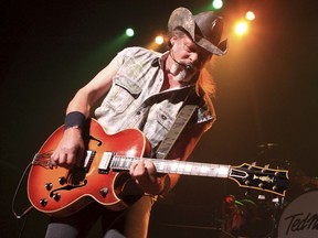 FILE - This Aug. 16, 2013, file photo shows Ted Nugent performing at Rams Head Live in Baltimore. David Crosby said on Twitter Aug. 14, 2017, Nugent has been snubbed from the Rock and Roll Hall of Fame because he "just isn't good enough," not because of his conservative politics. (Photo by Owen Sweeney/Invision/AP, File)