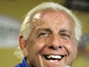 FILE - In this Sept. 22, 2007, file photo, wrestler Ric Flair addresses the media during a news conference at Dover International Speedway in Dover, Del. Flair's representative said on Twitter Aug. 14, 2017, that Flair was dealing with some "tough medical issues." (AP Photo/Carolyn Kaster, File)