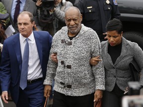 FILE – In this Dec. 30, 2015, file photo, Bill Cosby, center, accompanied by his attorneys Brian McMonagle, left, and Monique Pressley, right, arrives at court to face a felony charge of aggravated indecent assault, in Elkins Park, Pa. McMonagle, the lead defense lawyer in Cosby's sex assault trial that ended with a deadlocked jury on June 17, 2017, wants off the case before a retrial, according to documents the Philadelphia attorney filed Tuesday, Aug. 1, 2017, seeking to withdraw as Cosby's counsel. (AP Photo/Matt Rourke, File)