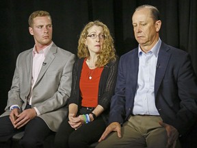 FILE – In this May 15, 2017, file photo, James Piazza, right, seated with his wife Evelyn, center, and son Michael, left, holds back emotions while discussing the death of his son, Penn State University fraternity pledge Tim Piazza, during an interview in New York. A preliminary hearing is set to resume Thursday, Aug. 10  for members of Penn State University's now-shuttered Beta Theta Pi fraternity chapter, accused in the Feb. 4 death of 19-year-old Tim Piazza, of Lebanon, N.J., after a night of heavy drinking. (AP Photo/Bebeto Matthews, File)