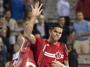 Milos Raonic waves to the crowd as he walks off the court after losing to Adrian Mannarino at the Rogers Cup on Aug. 9.