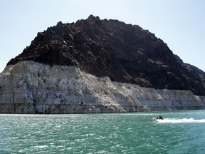 FILE - In this July 17, 2014, file photo, recreational boaters ride along in Lake Mead in the Lake Mead National Recreation Area in Nevada. U.S. water managers say there will be no water cutbacks in 2018 for millions of residents and farmers served by the Lake Mead reservoir on the Colorado River because of heavy snowfall last winter. (AP Photo/John Locher, File)