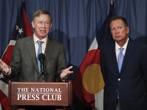FILE - In this June 27, 2017, file photo, Colorado Gov. John Hickenlooper, left, joined by Ohio Gov. John Kasich, speaks during a news conference at the National Press Club in Washington. The bipartisan governor duo is urging Congress to retain the federal health care law's unpopular individual mandate while seeking to stabilize individual insurance markets as legislators continue work on a long-term replacement law. Kasich, and Hickenlooper shared their plan in a letter to congressional leaders Thursday, Aug. 31, 2017. (AP Photo/Carolyn Kaster, file)