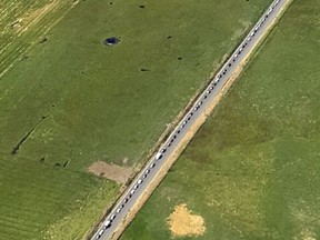 This aerial photo provided by the Oregon State Police shows a 15-mile traffic jam on Highway 26 heading in to Prineville, Ore., Thursday, Aug. 17, 2017. Traffic is already a headache in central Oregon as thousands of people are arriving before Monday's total solar eclipse. (Oregon State Police via AP)