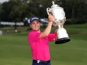 Justin Thomas holds the PGA Championship trophy on Aug. 13.