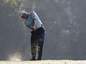 Ernie Els of South Africa, hits from the fairway on the 11th hole during the first round of the PGA Championship golf tournament at the Quail Hollow Club Thursday, Aug. 10, 2017, in Charlotte, N.C. (AP Photo/John Bazemore)