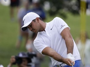 Jason Day of Australia, chips to the third green during the third round of the PGA Championship golf tournament at the Quail Hollow Club Saturday, Aug. 12, 2017, in Charlotte, N.C. (AP Photo/Chris O'Meara)