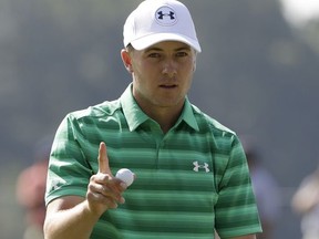 Jordan Spieth waves on the 15th green during the first round of the PGA Championship golf tournament at the Quail Hollow Club Thursday, Aug. 10, 2017, in Charlotte, N.C. (AP Photo/Chris O'Meara)