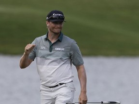Chris Stroud reacts after his putt on the 17th hole during the first round of the PGA Championship golf tournament at the Quail Hollow Club Thursday, Aug. 10, 2017, in Charlotte, N.C. (AP Photo/Chris O'Meara)
