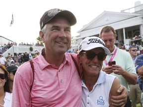 Jani, right, and Mike Thomas watch their son Justin Thomas win the PGA Championship golf tournament at the Quail Hollow Club Sunday, Aug. 13, 2017, in Charlotte, N.C. (AP Photo/John Bazemore)