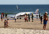 A small plane rests by the sea after an emergency landing at Sao Joao beach in Costa da Caparica, outside Lisbon, Wednesday, Aug. 2, 2017.