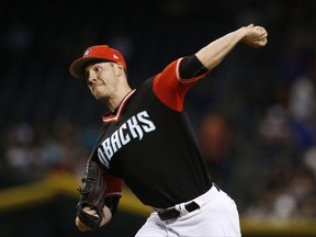 Arizona Diamondbacks' Patrick Corbin pitches against the San Francisco Giants during the first inning of a baseball game Sunday, Aug. 27, 2017, in Phoenix. (AP Photo/Ross D. Franklin)