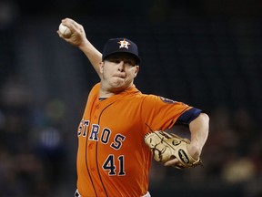 Houston Astros' Brad Peacock throws a pitch against the Arizona Diamondbacks during the first inning of a baseball game Tuesday, Aug. 15, 2017, in Phoenix. (AP Photo/Ross D. Franklin)
