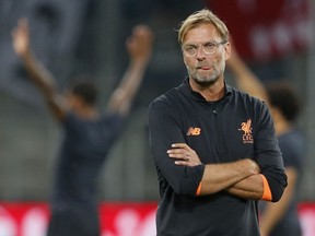 Liverpool's coach Juergen Klopp looks on prior to a Champions League's qualifier first leg soccer match between 1899 Hoffenheim and FC Liverpool, in the Rhein-Neckar-Arena, in Sinsheim, Germany, Tuesday, Aug. 15, 2017. (AP Photo/Michael Probst)