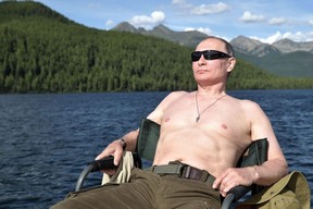 Russian President Vladimir Putin sunbathes during his vacation in the remote Tuva region in southern Siberia. The picture taken between August 1 and 3, 2017.