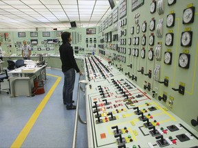 FILE - In this Oct. 6, 2009 file photo, of a worker as he checks the controls inside the control room of the nuclear power plant of Santa Maria de Garona in Spain. The Spanish government said on Tuesday Aug. 1, 2017 that it is closing the country's oldest nuclear power station Santa Maria de Garona,  because of lack of support among political parties and companies involved to keep it open and uncertainty surrounding the plant's viability. (AP Photo/I.Lopez, File)