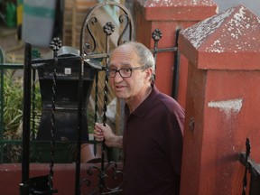 Turkish-born German writer Dogan Akhanli enters his lawyer's office in Madrid, Spain, Monday, Aug. 21, 2017. Germany is welcoming the release of Akhanli, who was detained in Spain on a Turkish warrant, and accused Turkey of abusing the international system used to hunt down fugitives after he was arrested Saturday while on holiday in southern Spain. (AP Photo/Paul White)