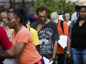 In this Monday, July 24, 2017 photo, Steven Kemp, who is addicted to heroin and is homeless, waits in line for help from a Philly Restart representative to obtain an identification card in Philadelphia, Monday, July 24, 2017. As an opioid epidemic ravages the nation, small but vulnerable populations of homeless people who are seeking respite from their addictions are sometimes turned away from the country's already threadbare system of drug treatment centers because they do not have valid photo identification (AP Photo/Matt Rourke)