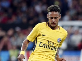 PSG's Neymar kicks the ball to make a pass during the French League One soccer match between Guingamp and PSG at the Roudourou stadium in Guingamp, western France, Sunday, Aug. 13, 2017. Neymar makes his long-awaited debut with Paris Saint-Germain on Sunday in the small Brittany town of Guingamp. (AP Photo/Kamil Zihnioglu)