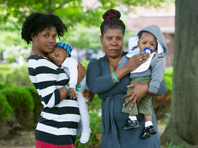 Asylum seekers Nadege Thomas with Jayden, left, and Marie Joseph and Joshua at the NAV centre in Cornwall, Ontario.